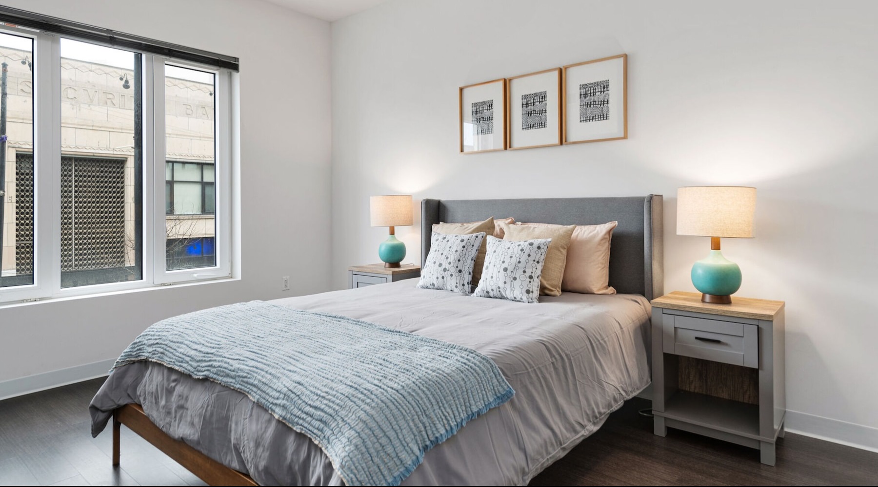 a bedroom with a bed and two nightstands