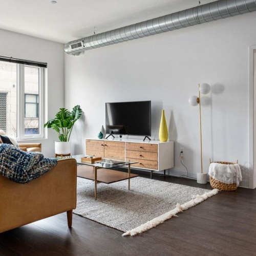 a living room with a couch and a tv