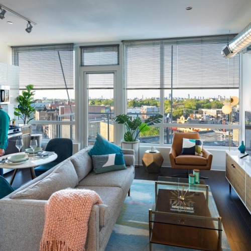 a couple of women and dog in a living room