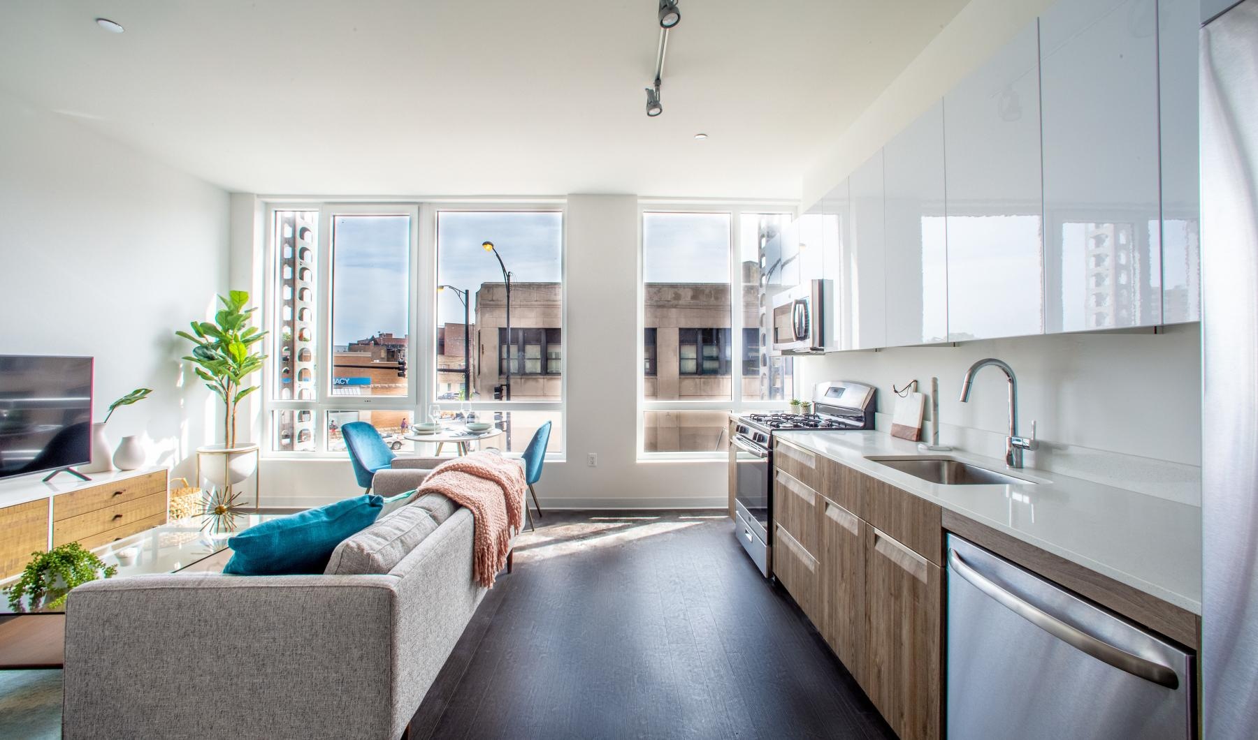 a kitchen with a couch and a sink
