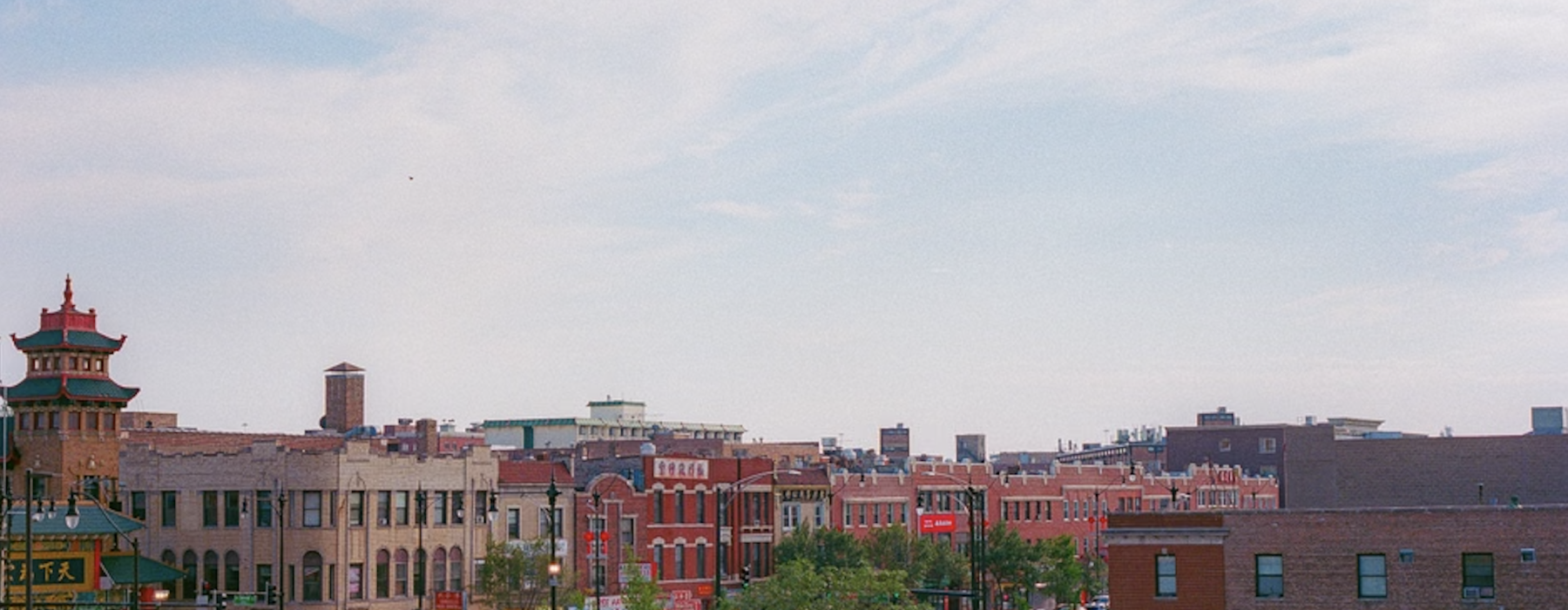 Logan Square Chicago Illinois neighborhood street view with boulevard and monument Edit Image