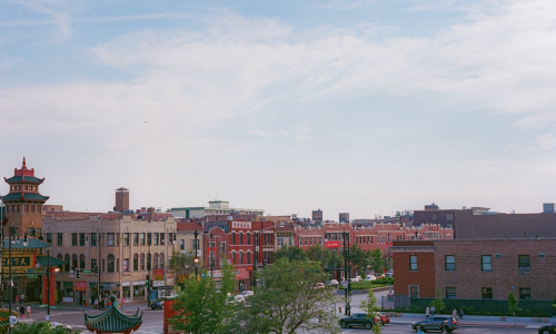 Logan Square Chicago Illinois neighborhood street view with boulevard and monument Edit Image
