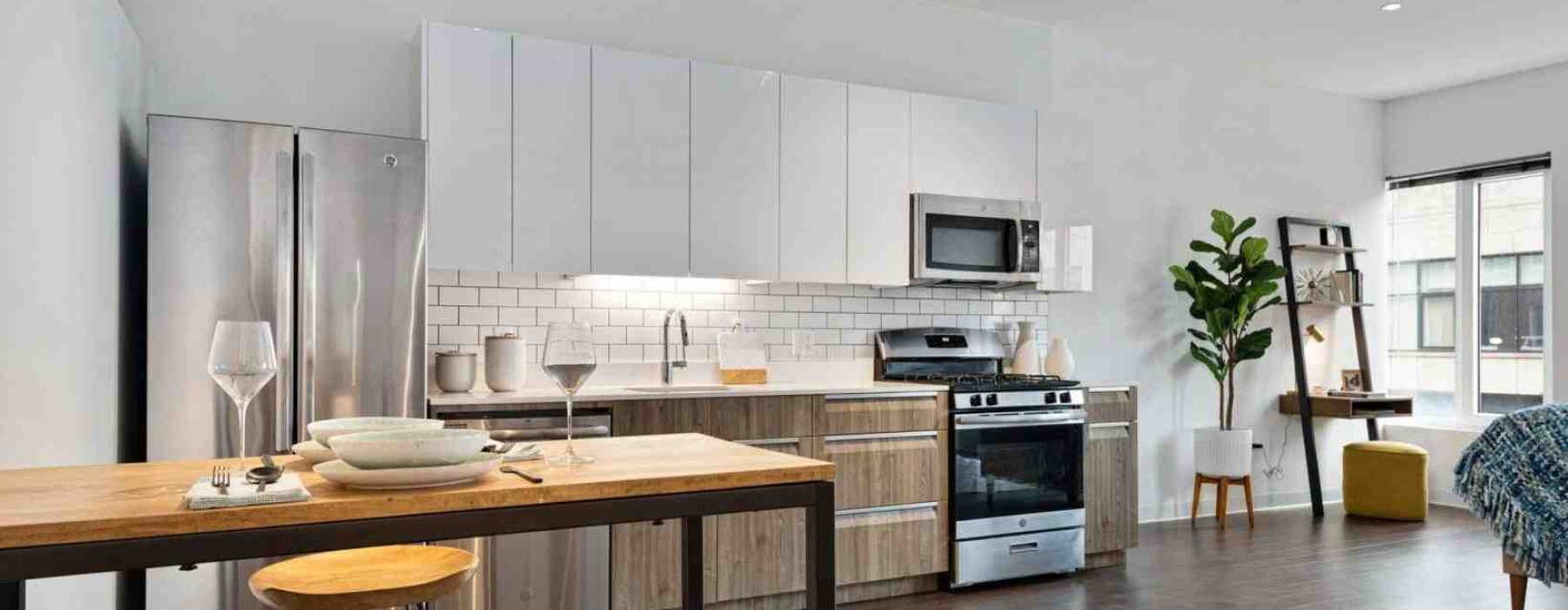 compact luxury studio apartment interior with reflective surfaces