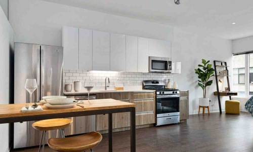 compact luxury studio apartment interior with reflective surfaces